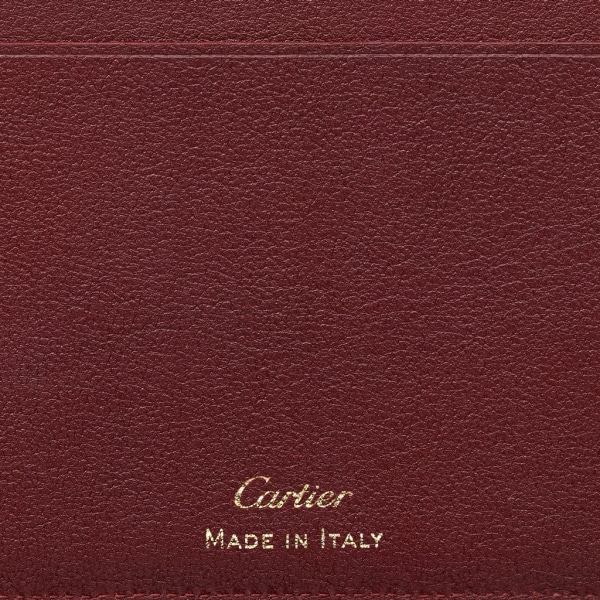 International Wallet with Gussets, Must de Cartier Burgundy calfskin, golden finish