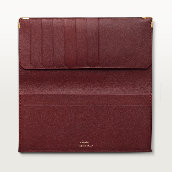 International Wallet with Gussets, Must de Cartier Burgundy calfskin, golden finish