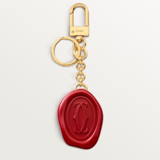 Diabolo de Cartier key ring with wax seal motif Lacquered golden-finish metal