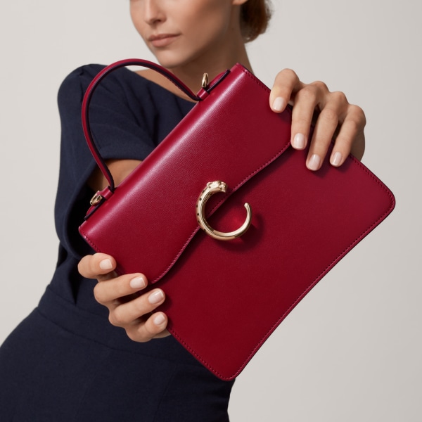 Top handle bag small model, Panthère de Cartier Cherry red calfskin, golden finish