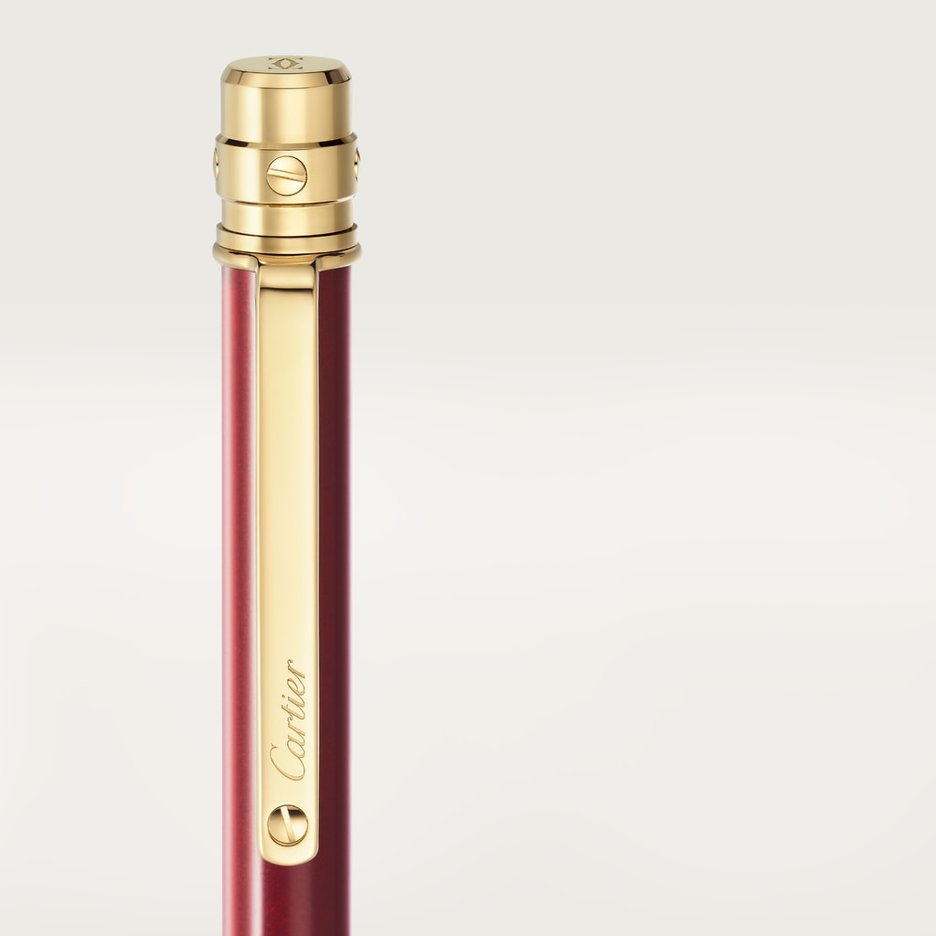 Santos de Cartier ballpoint penSmall model, burgundy lacquer, gold finish