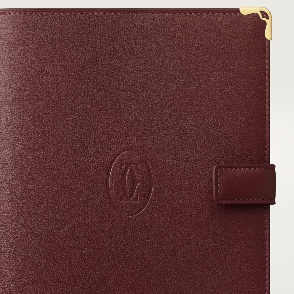 Must de Cartier SM notebook cover Burgundy calfskin, golden finish