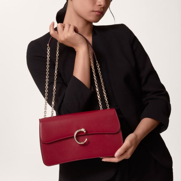 Small chain bag, Panthère de Cartier Cherry red calfskin, gold and black enamel finish