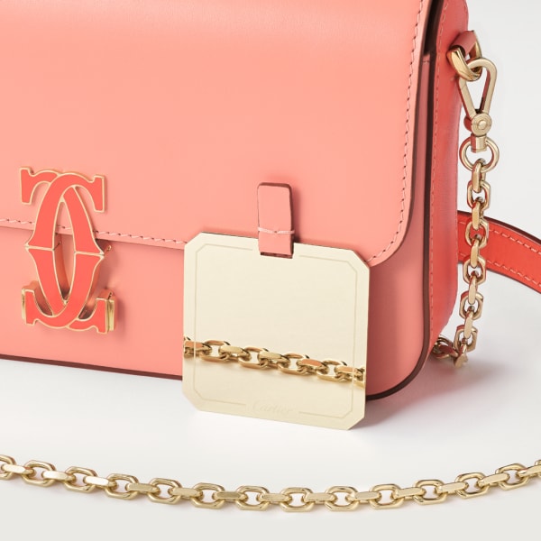 Mini chain bag, C de Cartier Two-tone coral/light coral calfskin, golden finish and coral enamel