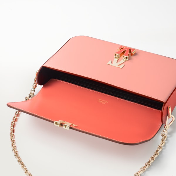 Mini chain bag, C de Cartier Two-tone coral/light coral calfskin, golden finish and coral enamel