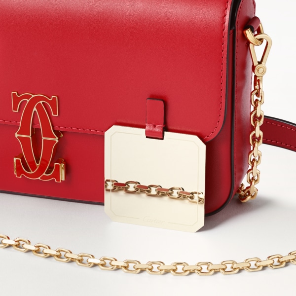 Mini model chain bag, C de Cartier Red calfskin, golden finish and red enamel