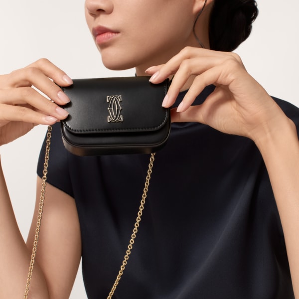 Micro chain bag, C de Cartier Black calfskin, gold and black enamel finish